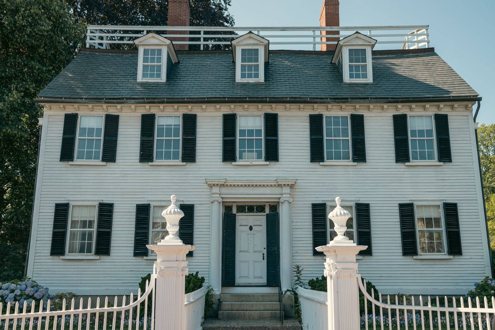 Classic white colonial house with black shutters